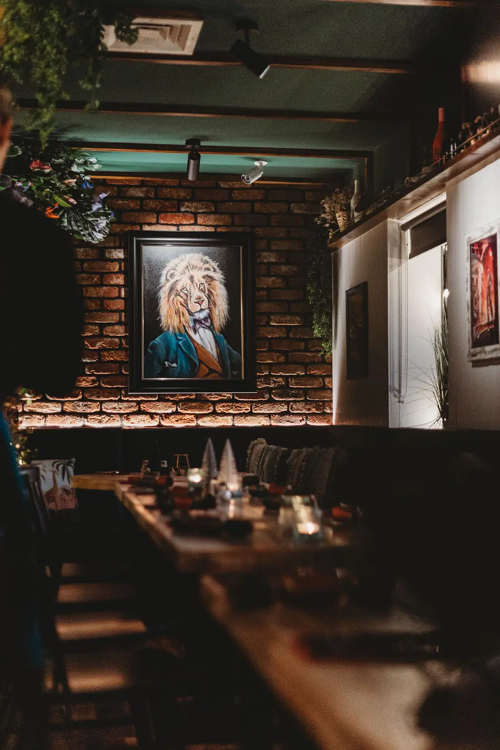 Candlelit tables under the lion portrait