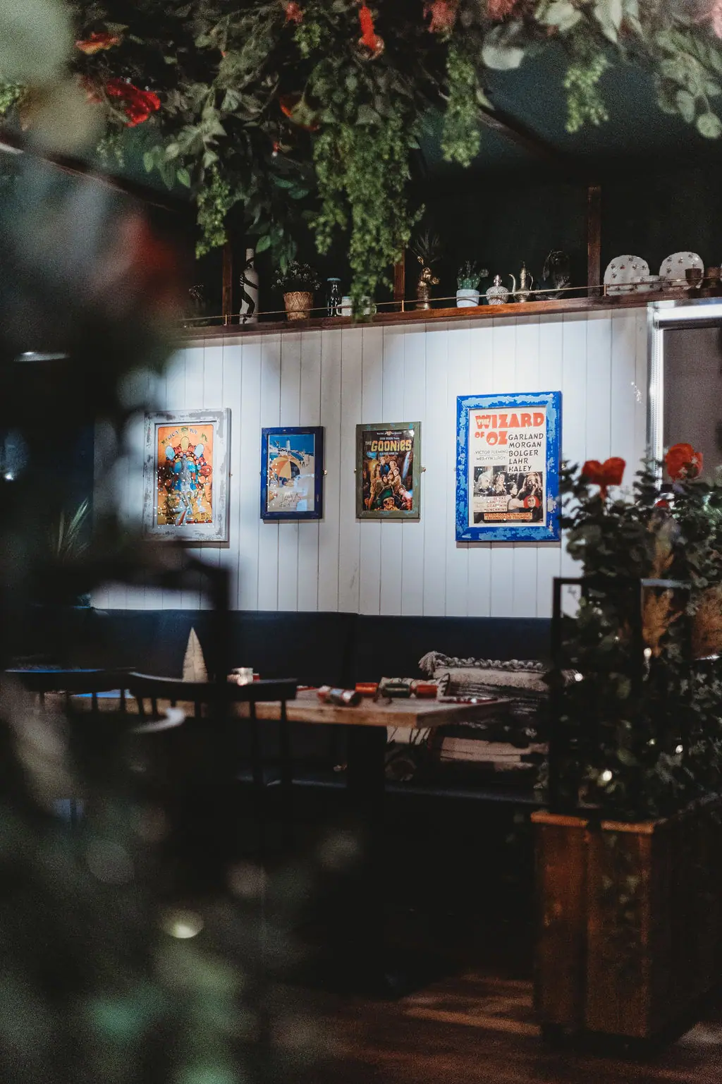 Banquette seating under framed film posters